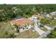 Aerial view of a large property with a pool, a house, a garage and tropical landscaping at 5266 Wagon Wheel Dr, North Port, FL 34291