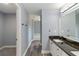 Bathroom featuring dual sinks, granite countertops, and modern finishes at 5266 Wagon Wheel Dr, North Port, FL 34291