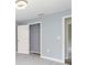 A bedroom with neutral tones, modern lighting, and a closet area for a peaceful atmosphere at 5266 Wagon Wheel Dr, North Port, FL 34291