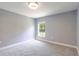 Bedroom with neutral carpeting, natural light, and modern ceiling light at 5266 Wagon Wheel Dr, North Port, FL 34291