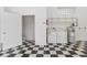 The large garage includes a laundry area, storage shelving, and a convenient half bathroom at 5266 Wagon Wheel Dr, North Port, FL 34291