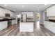 Open kitchen with island, stainless appliances, and modern design at 5266 Wagon Wheel Dr, North Port, FL 34291
