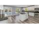 Kitchen with modern appliances, central island, and an outdoor view, perfect for cooking and entertaining at 5266 Wagon Wheel Dr, North Port, FL 34291