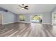 Open living room boasts stylish floors and view of outdoor pool at 5266 Wagon Wheel Dr, North Port, FL 34291