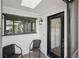 Inviting entryway with a decorative glass door, tiled floor, and chair seating at 532 Oak Hill Cir # 12, Sarasota, FL 34232