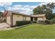 Well maintained single-story home featuring a beautiful lawn and mature landscaping at 532 Oak Hill Cir # 12, Sarasota, FL 34232