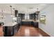 Spacious kitchen with an island, dark cabinets, and modern appliances, perfect for cooking and entertaining at 532 Oak Hill Cir # 12, Sarasota, FL 34232