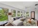 Bright living room featuring hardwood floors, a comfortable sofa, and large windows for natural light at 532 Oak Hill Cir # 12, Sarasota, FL 34232