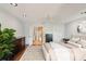 Airy main bedroom with hardwood floors, a ceiling fan, and an ensuite bathroom at 532 Oak Hill Cir # 12, Sarasota, FL 34232