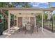 Pool area cabana with seating, a small sink and counter, and a nearby fence at 532 Oak Hill Cir # 12, Sarasota, FL 34232