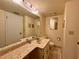 Bathroom featuring a marble vanity countertop and a full size mirror at 5400 34Th W St # H12, Bradenton, FL 34210