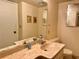 Bathroom featuring a marble vanity countertop and a full size mirror at 5400 34Th W St # H12, Bradenton, FL 34210