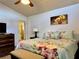 Spacious bedroom has a large bed, nice floors, and en suite bathroom at 5400 34Th W St # H12, Bradenton, FL 34210