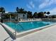 Inviting community pool with a clear blue water, surrounded by lounge chairs at 5400 34Th W St # H12, Bradenton, FL 34210