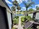 Beautiful community view overlooking a serene pond, lush landscaping, and palm trees at 5400 34Th W St # H12, Bradenton, FL 34210