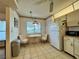 Bright breakfast nook in kitchen area, features a table and chairs at 5400 34Th W St # H12, Bradenton, FL 34210