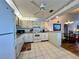 Cozy kitchen with white cabinets, a breakfast bar, and modern appliances at 5400 34Th W St # H12, Bradenton, FL 34210