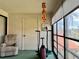 Relaxing sun room featuring a recliner, exercise equipment and natural lighting at 5400 34Th W St # H12, Bradenton, FL 34210