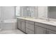Bright bathroom with double vanity, granite countertops, and a separate tub and shower at 5709 Wild Sage Cir, Sarasota, FL 34238