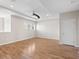 Spacious bedroom with light hardwood floors, neutral paint, a ceiling fan, recessed lighting, and a walk-in closet at 5709 Wild Sage Cir, Sarasota, FL 34238