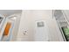 High ceiling with a bright entryway featuring wood-look floors and a white door with glass inserts at 5709 Wild Sage Cir, Sarasota, FL 34238