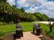 Community grilling area including new stainless steel grills at 5709 Wild Sage Cir, Sarasota, FL 34238
