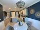 Lovely kitchen with a decorative light fixture, stainless appliances, an island and an eat-in table at 5709 Wild Sage Cir, Sarasota, FL 34238