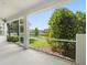Open-air lanai showing beautiful backyard landscape and inviting outdoor living space at 5709 Wild Sage Cir, Sarasota, FL 34238
