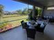 Comfortable lanai area with a dining area and an outdoor seating area at 5709 Wild Sage Cir, Sarasota, FL 34238