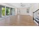 Expansive living room with wood floors, sliding glass doors, and ample space for entertaining at 5709 Wild Sage Cir, Sarasota, FL 34238
