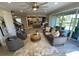 Open floor plan with bright living room and a view of the open kitchen, and access to the backyard at 5709 Wild Sage Cir, Sarasota, FL 34238