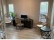 Bright office space with stylish decor, comfortable seating, and natural light at 5709 Wild Sage Cir, Sarasota, FL 34238