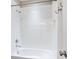 Clean, white tiled shower featuring a shower head and faucets at 5709 Wild Sage Cir, Sarasota, FL 34238