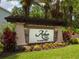 Entrance sign to the Arbor Lakes on Palmer Ranch community with manicured landscaping at 5709 Wild Sage Cir, Sarasota, FL 34238