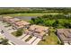 Beautiful home with lush landscaping, tile roof, and paver driveway; backing up to a golf course and pond at 5843 Wake Forest Run # 104, Bradenton, FL 34211