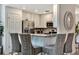 Modern kitchen with stainless steel appliances, breakfast bar, and seamless design at 5843 Wake Forest Run # 104, Bradenton, FL 34211
