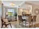 Charming kitchen with a breakfast bar, stainless steel appliances, and neutral color palette at 5843 Wake Forest Run # 104, Bradenton, FL 34211