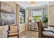 Bright kitchen nook with a breakfast bar, stylish seating, and a view of the outdoors at 5843 Wake Forest Run # 104, Bradenton, FL 34211