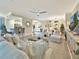 Bright and open living space with a view of the kitchen, dining area, and stylish furnishings at 5843 Wake Forest Run # 104, Bradenton, FL 34211