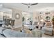 Inviting living room with stylish decor, neutral tones, and seamless flow to the kitchen and dining area at 5843 Wake Forest Run # 104, Bradenton, FL 34211