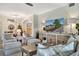 Comfortable living area with modern furnishings, a large television, and elegant decor at 5843 Wake Forest Run # 104, Bradenton, FL 34211