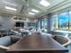 Inviting lounge area with comfortable seating, stylish decor, and ample natural light, perfect for relaxation and socializing at 5843 Wake Forest Run # 104, Bradenton, FL 34211