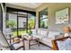 Inviting patio featuring an outdoor seating area and dining space, perfect for relaxation and entertainment at 5843 Wake Forest Run # 104, Bradenton, FL 34211