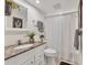 Bathroom features granite countertops, white cabinets, and a shower-tub combination at 6501 Mourning Dove Dr # 215, Bradenton, FL 34210