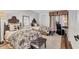 Charming bedroom with two beds featuring floral bedding, a desk and an area rug at 6501 Mourning Dove Dr # 215, Bradenton, FL 34210