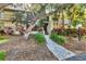 Inviting condo building with lush landscaping and a charming walkway leading to the entrance at 6501 Mourning Dove Dr # 215, Bradenton, FL 34210