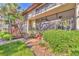 A welcoming exterior view of the condo building shows staircases and lush landscaping at 6501 Mourning Dove Dr # 215, Bradenton, FL 34210