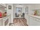 Cozy kitchen nook features a small table with two chairs and natural lighting from a window at 6501 Mourning Dove Dr # 215, Bradenton, FL 34210