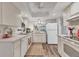 Well-maintained kitchen with white cabinets, and modern appliances at 6501 Mourning Dove Dr # 215, Bradenton, FL 34210