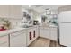 Bright kitchen with ample counter space and storage cabinets, perfect for cooking at 6501 Mourning Dove Dr # 215, Bradenton, FL 34210
